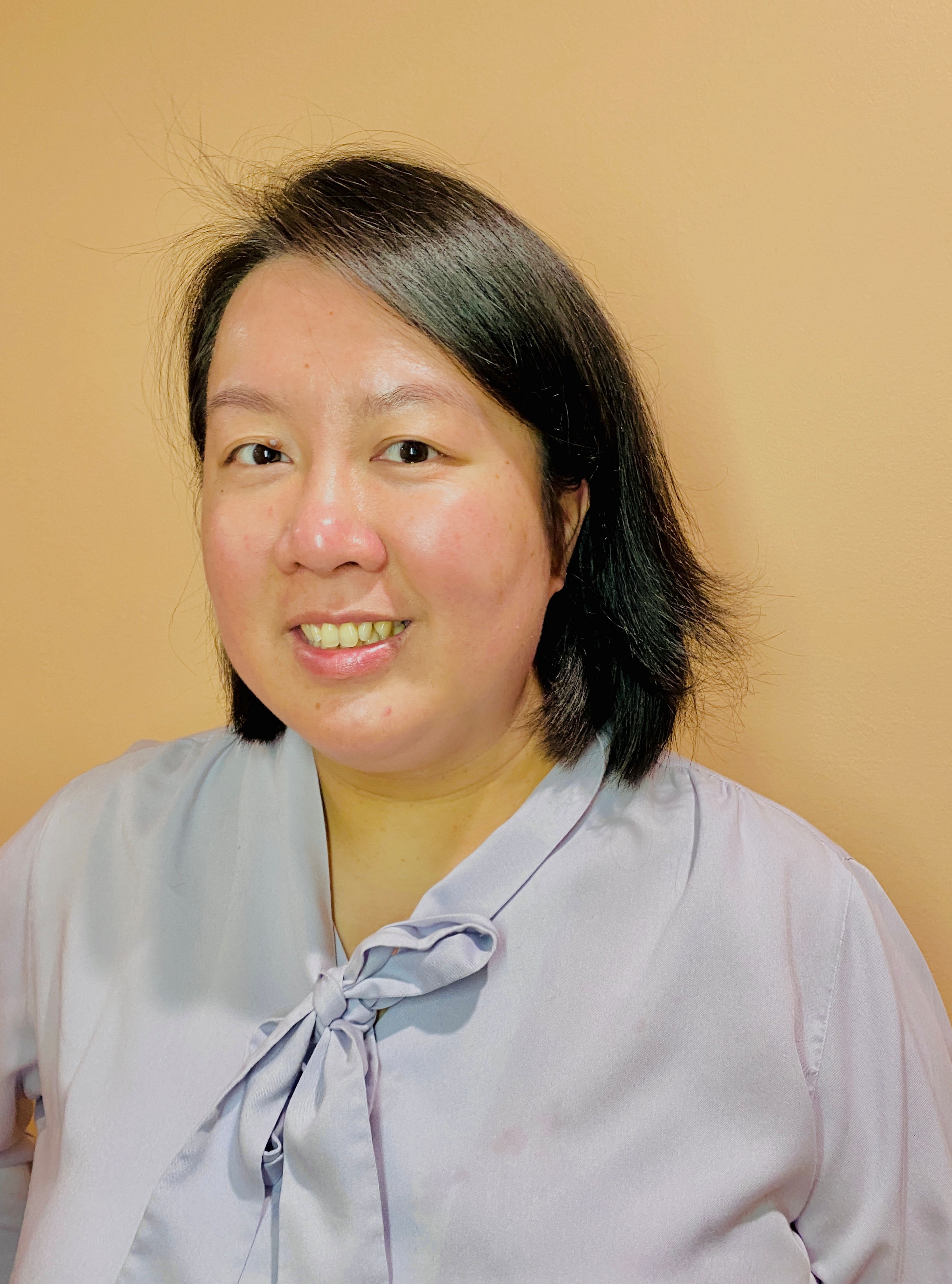 Professional headshot of Sandy Huen, Accounts Specialist at EzziTrust